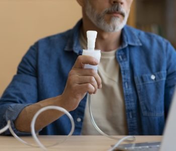front-view-man-using-nebulizer